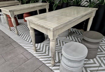skittle, turned table legs. stripes on the PVC floor. the dining area has a cottage in an...