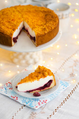 Homemade pie with cherry confit and sour cream souffle on laid table for tea party