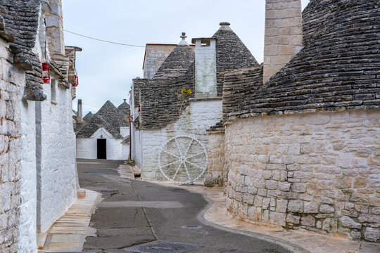 Alberobello iconic old Trullo and Trulli white houses with stone ceilings in conical shape, UNESCO World Heritage Site, Alberobello, Apulia, Italy