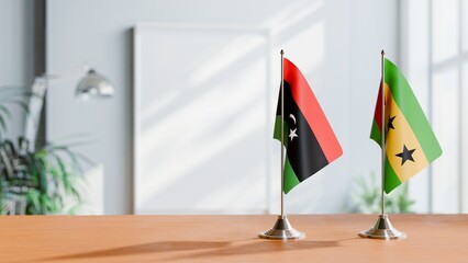 FLAGS OF LIBYA AND SAO TOME ON TABLE