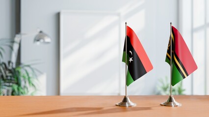 FLAGS OF LIBYA AND VANUATU ON TABLE