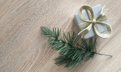 Festive top view Christmas scene with wrapped gifts, ornaments, and greenery arranged on a backdrop. Perfect for holiday themes and celebrations