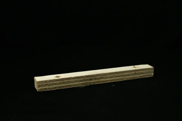 wooden pieces on a black background