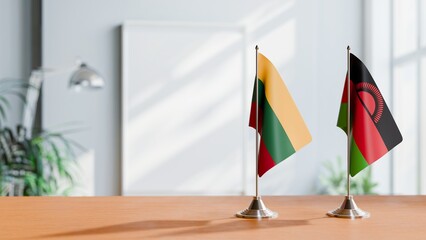 FLAGS OF LITHUANIA AND MALAWI ON TABLE