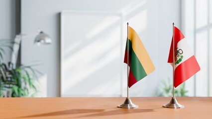 FLAGS OF LITHUANIA AND PERU ON TABLE