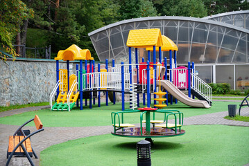 Colorful children's playground in a green park.