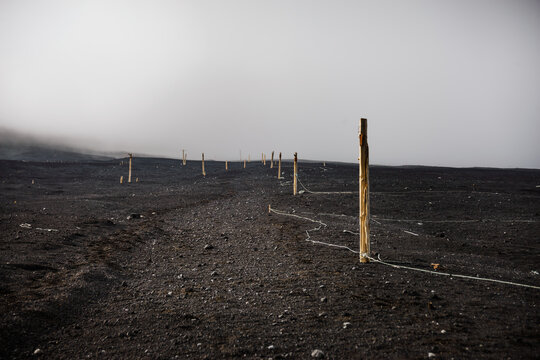 Hiking path in the ashes of Mount Fuji in a fog cloud, Honshu, Japan