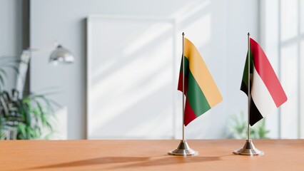 FLAGS OF LITHUANIA AND SUDAN ON TABLE