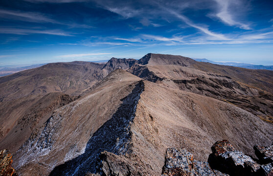 View from the summit of Pico del Veleta, with faults leading to Mulhacen, Sierra Nevada, Granada, Andalusia, Spain