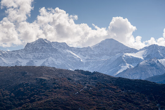 Panoramic view of the snowy Sierra Nevada with Alcazaba, Mulhacen and Pico de Veleta, viewed from Guejar Sierra, Sierra Nevada, Andalusia, Spain