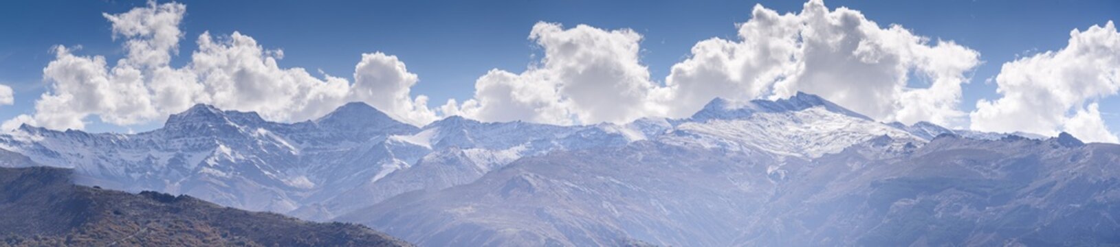 Panoramic view of the snowy Sierra Nevada with Alcazaba, Mulhacen and Pico de Veleta, viewed from Guejar Sierra, Sierra Nevada, Andalusia, Spain