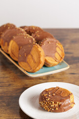Close up round croissants. Puff pastry New York Roll, supreme croissants. Trendy sweets baked by hand, with chocolate and almonds. Circular croissants.