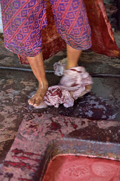 Feet fulling of cloth in the dyeing process, Kidang Mas Batik House, Lasem, Java island, Indonesia, Southeast Asia