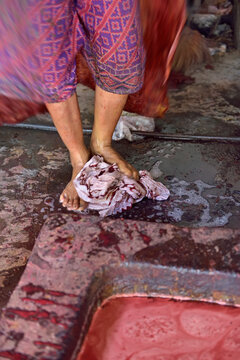Feet fulling of cloth in the dyeing process, Kidang Mas Batik House, Lasem, Java island, Indonesia, Southeast Asia