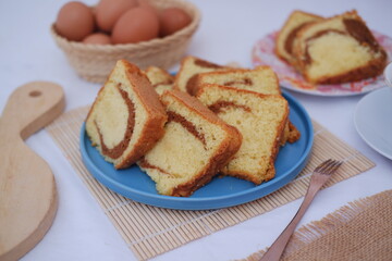 sponge cake on a plate with white background