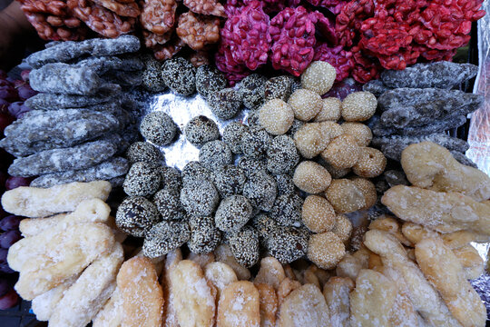 Variety of delicious cakes sold at street market stall, special food for Ramadan, Surabaya, Java, Indonesia, South East Asia