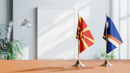 FLAGS OF MACEDONIA AND MARSHALL ISLANDS ON TABLE