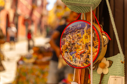 View of colourful souvenir tambourine in narrow backstreet in the fishing port, Procida, Phlegraean Islands, Gulf of Naples, Campania, Southern Italy, Italy