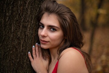 Autumn photo session of a girl with red dress