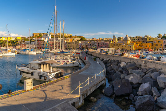 View of Church of Santa Maria della Pieta in the fishing port Marina Grande with boats at golden hour, Procida, Phlegraean Islands, Gulf of Naples, Campania, Southern Italy, Italy