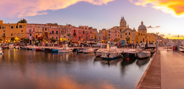View of Church of Santa Maria della Pieta in the fishing port Marina Grande with boats at golden hour, Procida, Phlegraean Islands, Gulf of Naples, Campania, Southern Italy, Italy