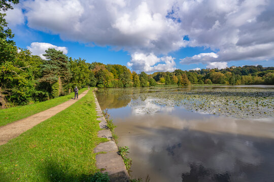 View of dramatic clouds refecting in Hardwick Ponds, Hardwick Park, Hardwick Hall, Bolsover, Derbyshire, England, United Kingdom