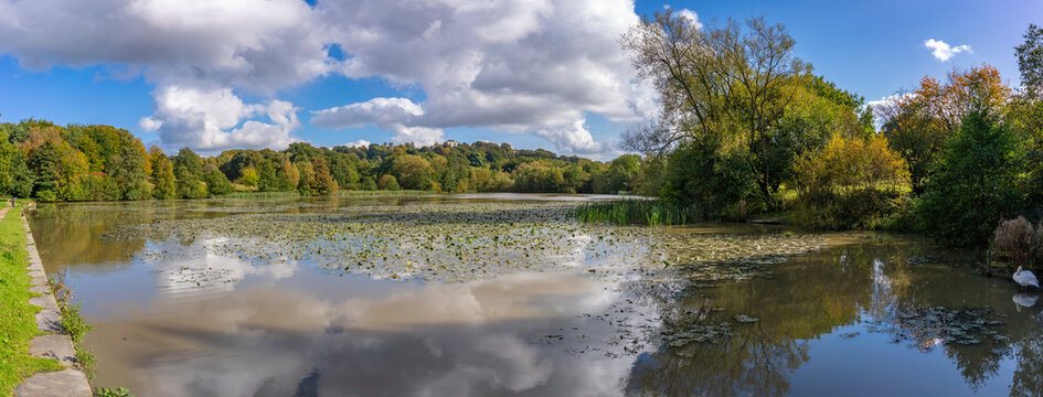 View of dramatic clouds refecting in Hardwick Ponds, Hardwick Park, Hardwick Hall, Bolsover, Derbyshire, England, United Kingdom