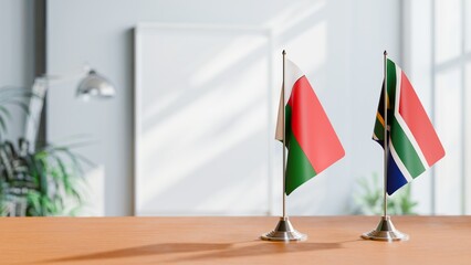 FLAGS OF MADAGASCAR AND SOUTH AFRICA ON TABLE