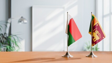 FLAGS OF MADAGASCAR AND SRI LANKA ON TABLE