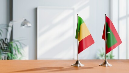 FLAGS OF MALDIVES AND MALI ON TABLE