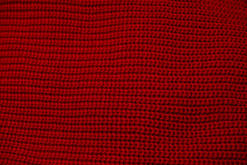 Obraz premium Red sweater texture as a background.