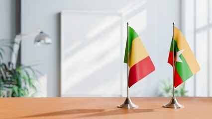 FLAGS OF MALI AND MYANMAR ON TABLE