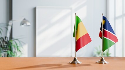 FLAGS OF MALI AND NAMIBIA ON TABLE