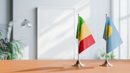 FLAGS OF MALI AND PALAU ON TABLE