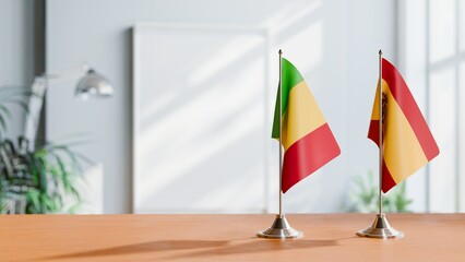 FLAGS OF MALI AND SPAIN ON TABLE