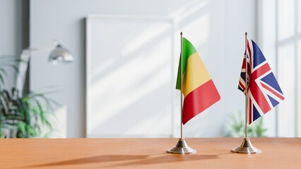 FLAGS OF MALI AND UNITED KINGDOM ON TABLE