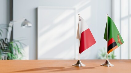 FLAGS OF MALTA AND ZAMBIA ON TABLE