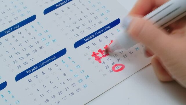 Woman hand crossing days in calendar, new year coming, end of a year