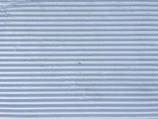 White and freshly groomed snow. Top view of snow prepared for snowboarding, skiing, nordic skiing, winter hiking, and other winter sports and activities.