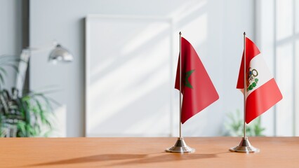 FLAGS OF MOROCCO AND PERU ON TABLE