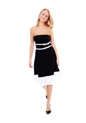 Fototapeta premium Portrait of a young beautiful blonde girl in a black dress