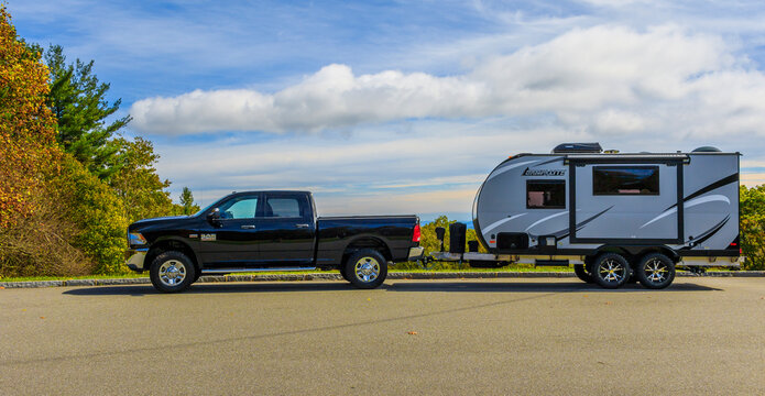 BLUE RIDGE MOUNTAINS, NC, USA-16 OCTOBER 17:  A Ram 2500 pickup towing a Camplite 16DBS travel trailer at an overlook on the Blue Ridge Parkway.