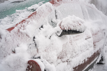 Red Electric Car Charging in the Snow