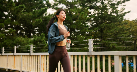 Japanese woman, running and fitness in city of sport exercise, marathon training and workout...