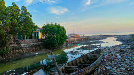 Water pollution due to human activities around downstream rivers and seas. damaged boats stranded...