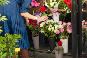 in a flower shop, the process of making a bouquet,