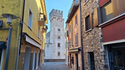 Sirmione, Italy - November 6, 2024: Scaliger Castle, the historic center of Sirmione, on the shores of Lake Garda.