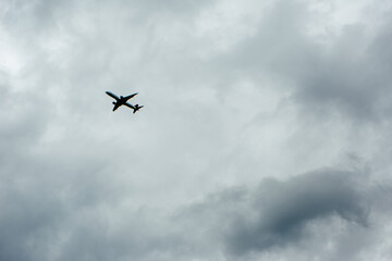 Airplane Flying in Cloudy Sky