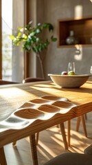 Cozy wooden table with a simple bowl of fresh fruit and a potted plant bathed in warm natural light and gentle shadows