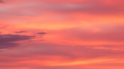 Obraz premium A dreamy sunset sky with hues of orange, pink, and purple blending into each other sea 